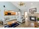 Bright living room featuring a fireplace, vaulted ceilings and an opening to the kitchen at 20 Brassie Dr., Carolina Shores, NC 28467