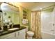 Well-lit bathroom with a tub-shower combination and beach-themed decor at 2007 S Ocean Blvd. # 1106, Myrtle Beach, SC 29577