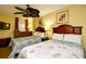 Cozy bedroom with two comfortable beds, offering a warm and relaxing ambiance at 2007 S Ocean Blvd. # 1106, Myrtle Beach, SC 29577