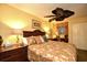 Cozy bedroom featuring warm lighting, wooden furnishings, and a comfortable bed setup at 2007 S Ocean Blvd. # 1106, Myrtle Beach, SC 29577