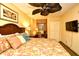 Relaxing bedroom featuring comfortable bedding, a ceiling fan, and a functional workspace at 2007 S Ocean Blvd. # 1106, Myrtle Beach, SC 29577