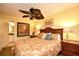 Inviting bedroom showcases warm lighting, wood furniture, and ensuite bathroom access at 2007 S Ocean Blvd. # 1106, Myrtle Beach, SC 29577