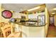 Charming kitchen with stainless steel appliances and granite countertops offers a cozy breakfast bar at 2007 S Ocean Blvd. # 1106, Myrtle Beach, SC 29577