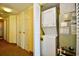 Hallway laundry area featuring a stackable washer and dryer and closet at 2007 S Ocean Blvd. # 1106, Myrtle Beach, SC 29577