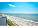 High-angle view of the beach with blue umbrellas and clear water at 2007 S Ocean Blvd. # 1106, Myrtle Beach, SC 29577