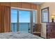 Bedroom with a view of the ocean, a balcony, and a chair at 2007 S Ocean Blvd. # 1106, Myrtle Beach, SC 29577