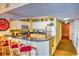 Well-equipped kitchen featuring granite countertops, white cabinetry, and a breakfast bar at 2007 S Ocean Blvd. # 1106, Myrtle Beach, SC 29577