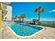 Inviting outdoor pool area offering a refreshing experience with beach view, and palm tree landscaping at 2007 S Ocean Blvd. # 1106, Myrtle Beach, SC 29577