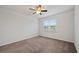 A carpeted bedroom with a ceiling fan and a window at 253 Forestbrook Cove Circle, Myrtle Beach, SC 29588