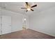 Minimalist bedroom featuring a ceiling fan and an adjacent bathroom at 253 Forestbrook Cove Circle, Myrtle Beach, SC 29588