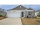 Charming single Gathering home featuring a 1-car garage, driveway and a combination of vinyl siding and brick at 253 Forestbrook Cove Circle, Myrtle Beach, SC 29588