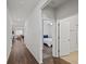 Spacious hallway featuring wood floors and providing views into a bedroom and living room at 253 Forestbrook Cove Circle, Myrtle Beach, SC 29588