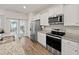 Well-equipped kitchen featuring stainless steel appliances, ample cabinetry, and granite countertops at 253 Forestbrook Cove Circle, Myrtle Beach, SC 29588