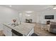 Well-lit kitchen island with granite countertops and stainless steel dishwasher and sink at 253 Forestbrook Cove Circle, Myrtle Beach, SC 29588