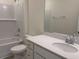 Bathroom features a white vanity with quartz countertop, stylish fixtures, and tiled shower and tub combo at 264 Palmetto Sand Loop, Conway, SC 29527