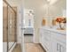 Bathroom featuring dual vanity sinks, a glass shower, and neutral color tones at 264 Palmetto Sand Loop, Conway, SC 29527