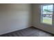 Neutral bedroom with plush carpeting and a large window providing natural light and neighborhood views at 264 Palmetto Sand Loop, Conway, SC 29527