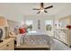 Well-lit bedroom with plush carpet, large windows overlooking a lake, and cozy furniture at 264 Palmetto Sand Loop, Conway, SC 29527