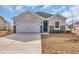 Inviting single-Gathering home with a white garage door, blue door, and well-kept lawn at 264 Palmetto Sand Loop, Conway, SC 29527