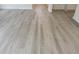 Durable and stylish light wood-style laminate flooring throughout this home's open living spaces at 264 Palmetto Sand Loop, Conway, SC 29527