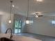 Bright living room featuring recessed lighting, modern pendant lights, and sliding glass door access to the backyard at 264 Palmetto Sand Loop, Conway, SC 29527