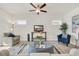 Cozy living room featuring a ceiling fan, modern furniture, and natural light at 264 Palmetto Sand Loop, Conway, SC 29527