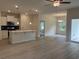 Open-concept living room and kitchen with modern finishes, stainless appliances, and light wood flooring at 264 Palmetto Sand Loop, Conway, SC 29527