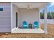 Covered patio with two chairs and a table, perfect for outdoor relaxation at 264 Palmetto Sand Loop, Conway, SC 29527