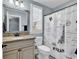 Bathroom featuring a vanity with granite countertop and shower with decorative curtain at 2840 Mcleod Ln., Myrtle Beach, SC 29588