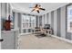 Bedroom with striped walls, a ceiling fan, and two work areas at 2840 Mcleod Ln., Myrtle Beach, SC 29588