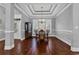 Formal dining room with wainscoting, tray ceiling, chandelier, and plantation shutters at 2840 Mcleod Ln., Myrtle Beach, SC 29588