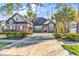 Charming brick home with a long driveway and manicured landscaping with palm trees at 2840 Mcleod Ln., Myrtle Beach, SC 29588