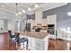 Open-concept kitchen featuring an island with bar seating and stainless steel appliances at 2840 Mcleod Ln., Myrtle Beach, SC 29588