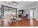 Bright living room with large windows, hardwood floors, and a view into the bathroom at 2840 Mcleod Ln., Myrtle Beach, SC 29588