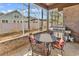 Cozy screened patio with outdoor dining set and stainless steel grill at 2840 Mcleod Ln., Myrtle Beach, SC 29588