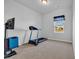 A simple bedroom features a treadmill and tv at 3032 Red Bark Dr., Conway, SC 29526