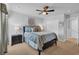 Cozy bedroom featuring a comfortable bed, carpeted floors, ceiling fan and a closet for storage at 3032 Red Bark Dr., Conway, SC 29526