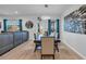 Bright dining room with modern light fixture, seating for six, and stylish decor completes the space at 3032 Red Bark Dr., Conway, SC 29526