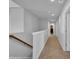 Hallway with carpeted floors leading to various rooms, offering a functional and inviting space at 3032 Red Bark Dr., Conway, SC 29526