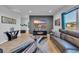 Cozy living room with modern decor, fireplace, gray accent wall, and comfortable seating area at 3032 Red Bark Dr., Conway, SC 29526