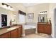 This bathroom features double sinks, a tub, and a walk-in closet at 320 Esher Ct., Myrtle Beach, SC 29579