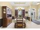 Traditional dining room with a wooden hutch, chandelier, and neutral color palette at 320 Esher Ct., Myrtle Beach, SC 29579