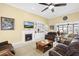 Bright living room featuring a fireplace, built-in shelves, and neutral carpet at 320 Esher Ct., Myrtle Beach, SC 29579