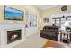 Cozy living room with fireplace, TV, and built-in shelving at 320 Esher Ct., Myrtle Beach, SC 29579