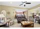 Comfortable living room featuring ceiling fan and neutral carpet at 320 Esher Ct., Myrtle Beach, SC 29579