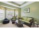 Relaxing sitting room with bay windows, wicker furniture, and a tropical theme at 320 Esher Ct., Myrtle Beach, SC 29579