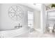 Bright bathroom featuring a modern tub, shower, toilet, compass decor, and elegant white accents at 3964 Lochview Dr., Myrtle Beach, SC 29588