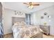 Bedroom with a decorative headboard, ceiling fan, ample closet space and light grey walls at 3964 Lochview Dr., Myrtle Beach, SC 29588