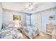 Bright bedroom with twin beds, beachy wallpaper, and a sun-drenched window at 3964 Lochview Dr., Myrtle Beach, SC 29588