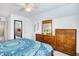 Comfortable bedroom showcasing a large dresser and full-length mirror at 3964 Lochview Dr., Myrtle Beach, SC 29588